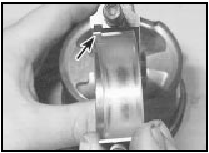 14.5 Ensure that the tab (arrowed) is correctly located in the connecting rod