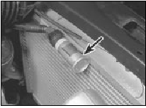 5.4c On TU series engines, remove the cooling fan relay (arrowed)