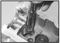 6.28 Fitting a valve stem oil seal using a socket