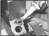 13.56 Applying sealant to the cylinder block No 1 main bearing cap mating
