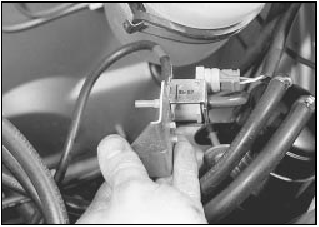 8.7b . . . and withdraw the solenoid bracket