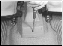 15.4 Remove the screw and lift the cover from the handbrake lever
