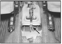 15.5 Handbrake adjustment nut and locknut (arrowed)