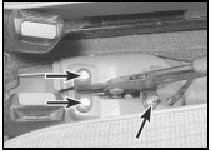 18.3 Handbrake lever mounting bolts (arrowed)