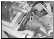 3.10 Disconnecting the coil wiring connector (arrowed) on TU series engines