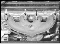 3.5 Exhaust manifold upper retaining nuts (arrowed)